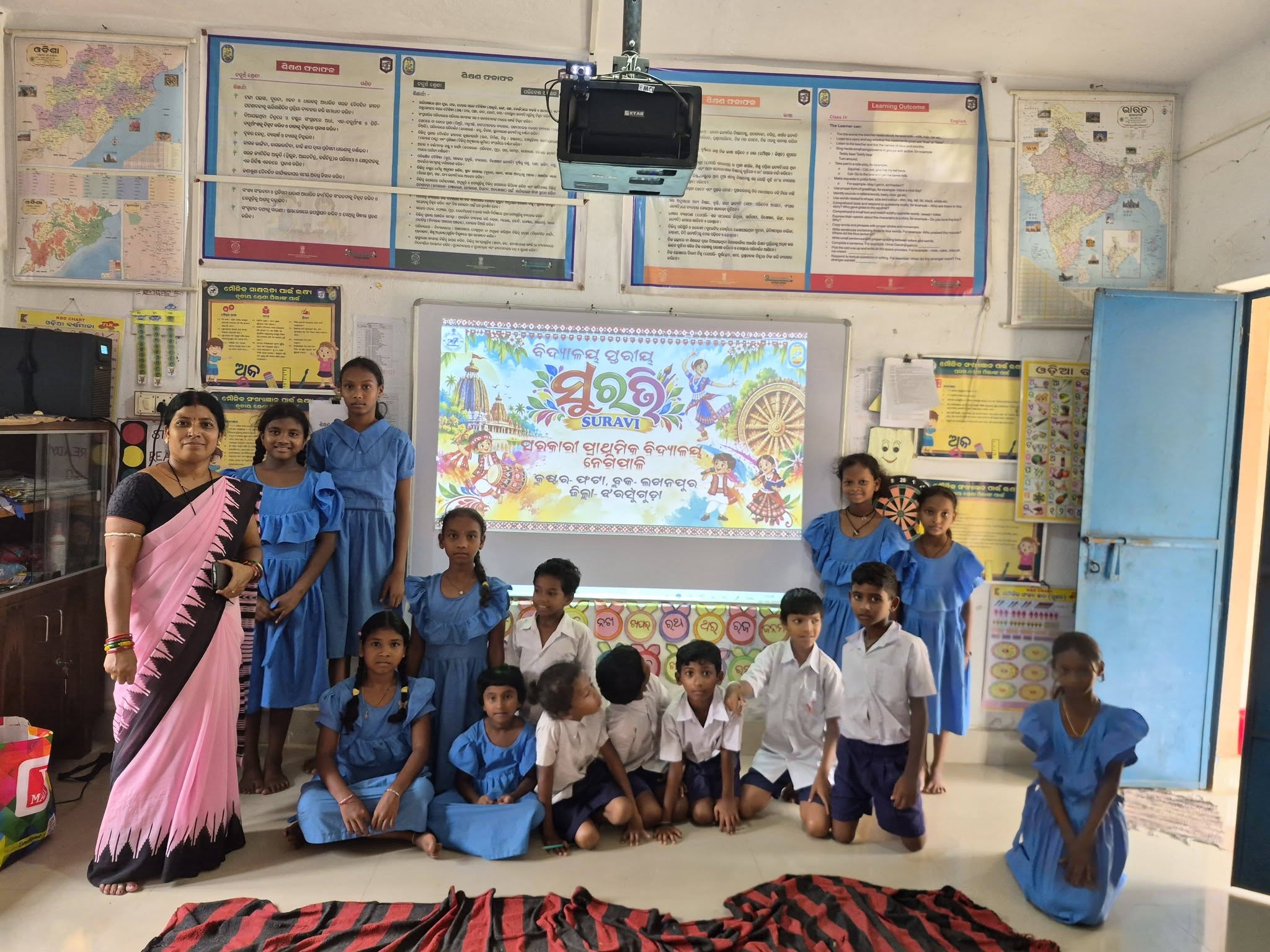 School-Level SURAVI: A Moment from My School Students and Reena beside the school-level SURAVI banner