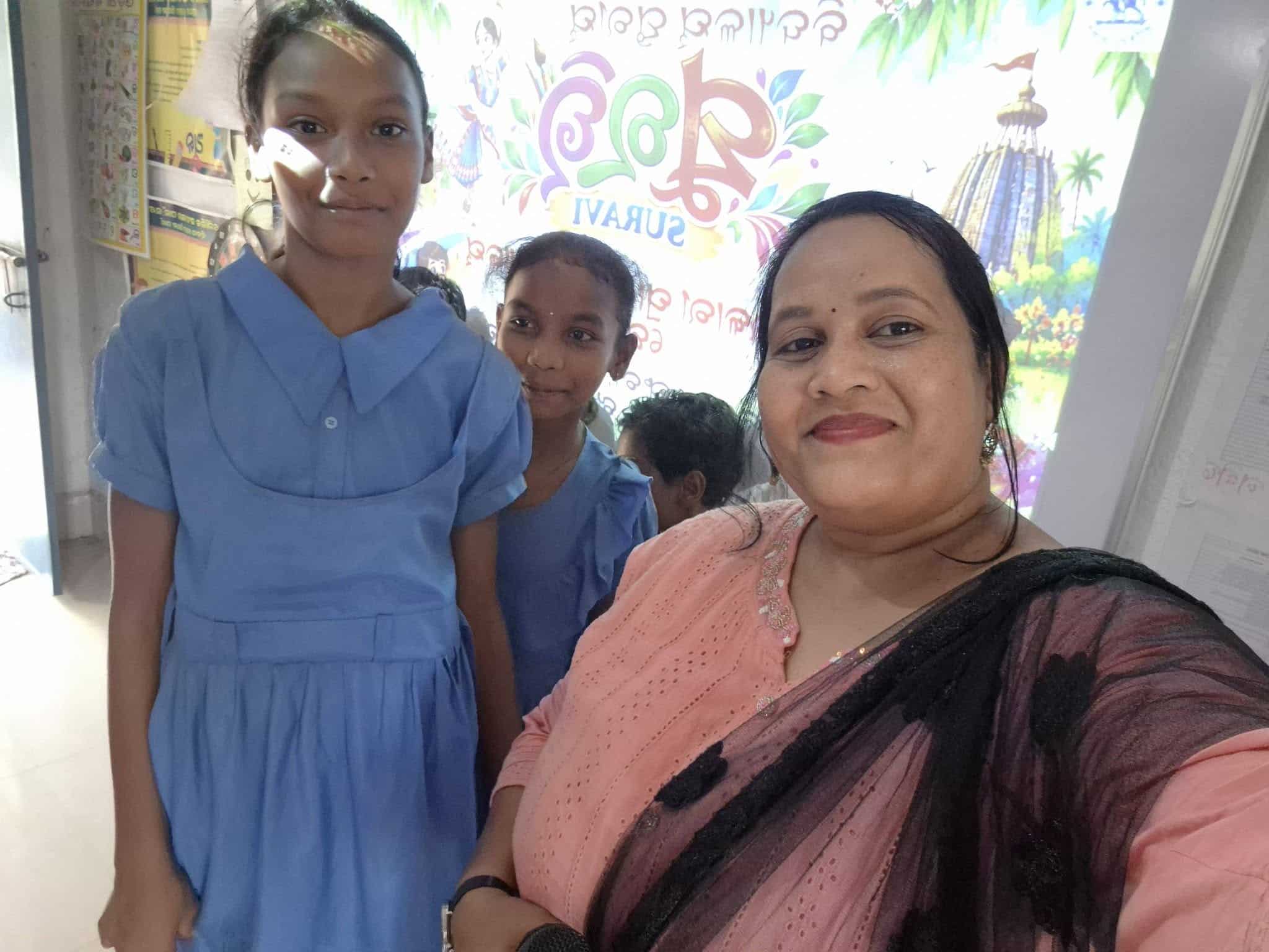 School-Level SURAVI: A Moment from My School Reena with two students at school-level SURAVI