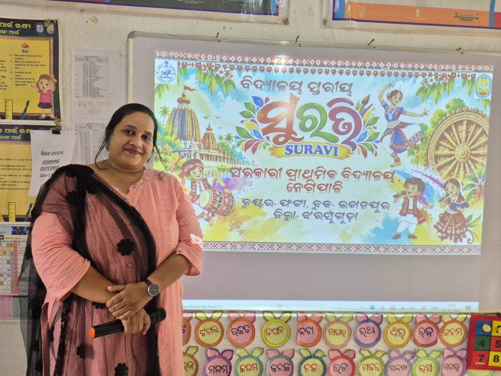 School-Level SURAVI: A Moment from My School Reena Rani Dehuri holding a microphone beside the school-level SURAVI banner at Negipali